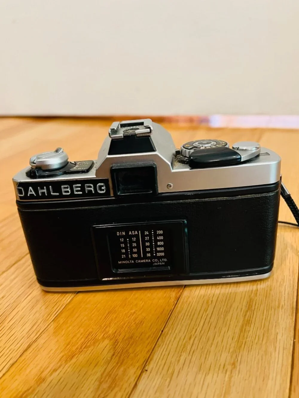 vintage Minolta XG-9 35mm SLR film camera equipped with a 50mm prime lens